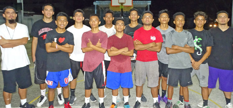 The RMI Under-17 boys basketball team with coaches Boki Hiram (left) and Melu Wase (right). Photo: Isaac Marty. FIBA U17 boys/girls basketball games