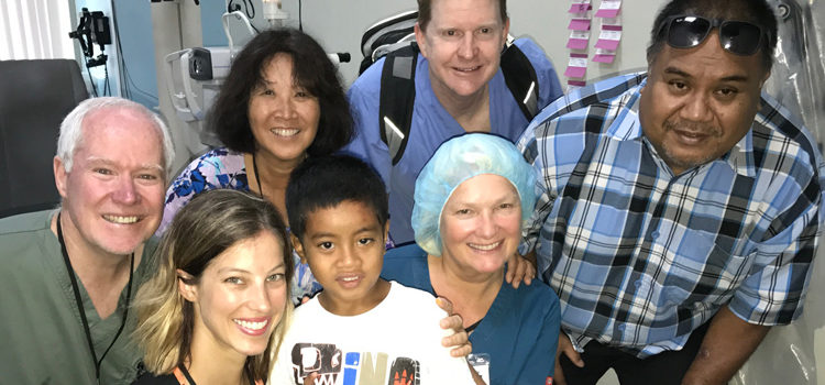 The Canvasback Missions visiting eye team with six-year-old Robuti Jack at Majuro hospital, from left: Dr. Bruce Flint, Dr. Kimberly Browne, Canvasback Director Jacque Spence, Dr. David Gano, Dr. Sally Mellgren (who performed the eye surgeries on Robuti), and Thomas Jack, Robuti Robuti sees for the first time