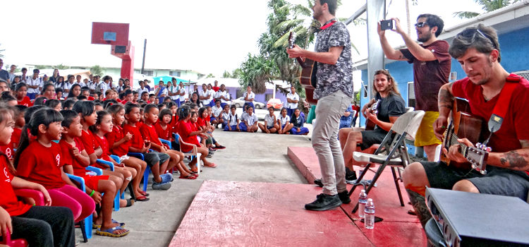 ACIDIC band members engage with Majuro Cooperative School and Seventh Day Adventist students under Coop’s outdoor gym Tuesday. Photo: Hilary Hosia LA band tours Majuro