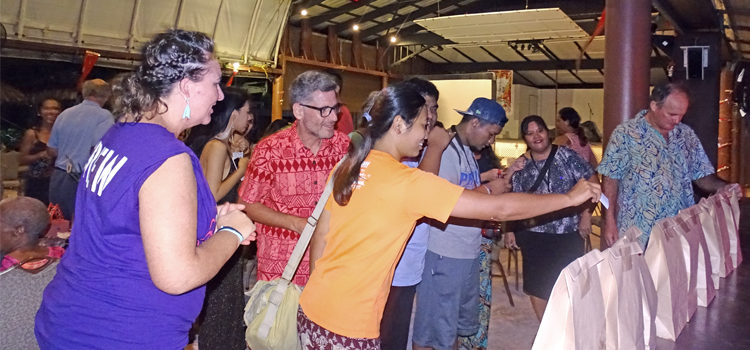 Jambo Arts President Angela Saunders (left) and Marshallese Be Like Film Festival attendees cast their votes for favorite films shown at Jitak En Likatu Bar Friday. Photo: Hilary Hosia. Be Like, We Like!