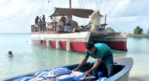 The Okeanos canoe in Maloelap delivering food before Christmas. Photo: Ivanancy Vunikura