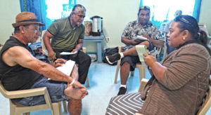 Engaged in Red Cross first aid training, from left: Rebel John, Simpson Lalej, Takuchi Shima and Ramanty Chong Gum work together through an exercise as part of their training to become first aid trainers. Photo: Hilary Hosia