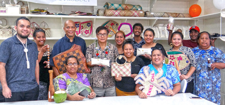 Bank of Marshall Islands President Patrick (center holding bag of Ebon flour) joined with Arlington Tibon (third from left), Marshall Islands Service Corporation and BOMI staff at the opening of the new Local Market in Uliga. Photo: Hilary Hosia. MISCO’s opening is very grand