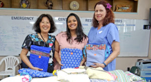 Canvasback Co-Founder Jacque Spence (left) joined with team member Gynecologist Kathy Hayes (right) to deliver a donation of supplies for patients at Majuro hospital. Receiving them on behalf of the ministry was Acting Secretary Francyne Wase-Jacklick. Photo: Hilary Hosia.