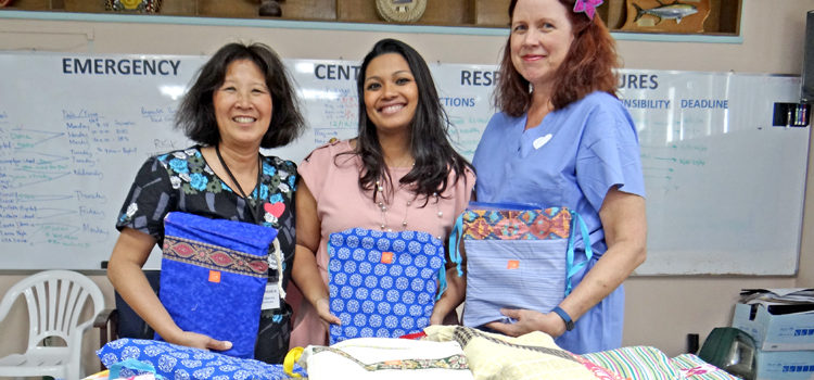 Canvasback Co-Founder Jacque Spence (left) joined with team member Gynecologist Kathy Hayes (right) to deliver a donation of supplies for patients at Majuro hospital. Receiving them on behalf of the ministry was Acting Secretary Francyne Wase-Jacklick. Photo: Hilary Hosia. Women get Canvasback help