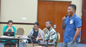 Health Minister Kalani Kaneko addresses a briefing session with local non government organizations. Ministry staff Mailynn Lang, Francyne Wase-Jacklick and Paul Alee are also pictured. Photo: Hilary Hosia.