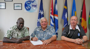 Signing the contract for construction of a new PNA HQ building in Majuro are, from left: PNA CEO Ludwig Kumoru and Pacific International Inc. CEO Jerry Kramer, as PNA Commercial Manager Maurice Brownjohn looks on. Photo: Rebecca Lathrop.
