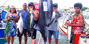 Team Dragon, captained by Rudy Aliven (standing next to marlin, right), “caught five” fish species to win the Catch Five carry over prize from a previous tournament during Friday’s first day of fishing in the 36th annual Marshalls Billfish Club July tournament. Photo: Hilary Hosia.