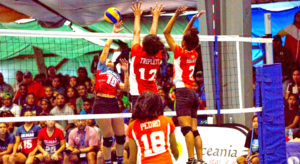 RMI women’s volleyball players Sidra Triplett and Aliyah Brown stretch to block a Guam spike, as Rutha Pedro readies to defend. Photo: 9th Micronesian Games Media.