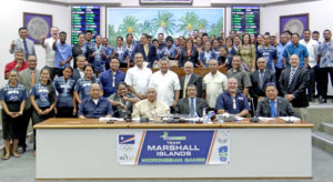 Athletes, coaches and administrators for Team RMI that competed at the Micronesian Games in Yap last month join with Nitijela members in a recognition ceremony Monday in the chamber. Photo: Hilary Hosia.