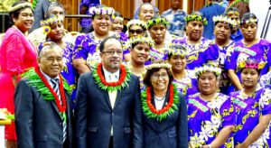 At Nitijela Monday, after the formal opening ceremony, from left: Majuro Iroijlaplap Lein Zedkeia, First Gentleman Tommy Kijiner, Jr. and President Hilda Heine joined the Aur singing group. Photo: Kelly Lorennij.
