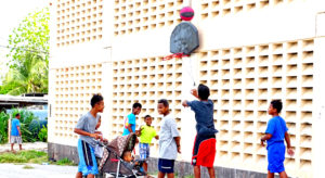 Since 2011, the ECC gym in Majuro has been locked up, useful only as a support for outdoor basketball backboards and hoops. Photo: Hilary Hosia.