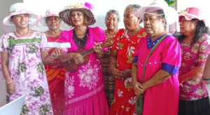 Nika Wase (playing ukulele) led a cancer survivor group in song at last week’s Breast Cancer Awareness Pink Tea Party at Marshall Islands Resort. Photo: Kelly Lorennij.