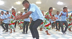 Marshalls Christian High School student Balaan Langidrik leads the spirited jepta from Rongrong Island during a performance at Uliga Protestant Church Christmas night. Photo: Hilary Hosia.