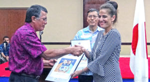 Above, Jennifer Hawley, granddaughter of founding father and first president Amata Kabua was presented with a commemorative stamp from the government of Japan. Photo: Hillary Hosia