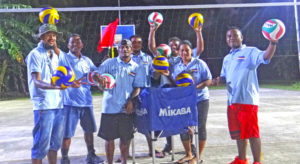 Majuro Day officials pose with donated volleyballs at Jeirok multi-purpose court donated by the Marshall Islands National Olympic Committee. Photo: Belle Jorbelle