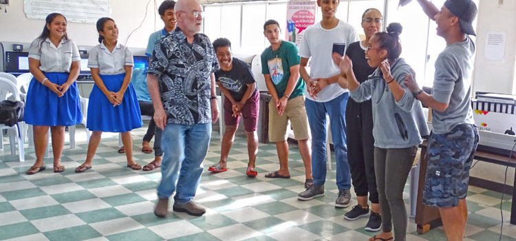 A rehearsal session for The Music Man gets the actors involved in learning how to express themselves for the musical. Professor Andrew Garrod is in the center, with Dartmouth Students Tyler Malbreaux and Summer Cody at right with local students. Photo: Hilary Hosia. Music Man swings into action