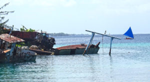 A motorboat carrying five men collided with the superstructure of a sunken vessel (visible in the photo) near the Riwut Corner boat ramp, killing one of the passengers. Photo: Kelly Lorennij.