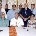 Marshall Islands Ports Authority board Chair Robert Pinho and Majuro Mayor Ladie Jack, seated center, signed an agreement for the two entities to work together. The event was witnesses by Majuro’s five Nitijela members, and MALGov and Ports Authority representatives. Photo: Hilary Hosia