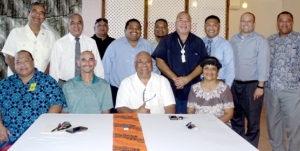 Marshall Islands Ports Authority board Chair Robert Pinho and Majuro Mayor Ladie Jack, seated center, signed an agreement for the two entities to work together. The event was witnesses by Majuro’s five Nitijela members, and MALGov and Ports Authority representatives. Photo: Hilary Hosia