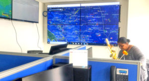 The fisheries surveillance command center at the new MIMRA headquarters features a constantly updated large screen presentation showing the locations of all fishing vessels in the Pacific region. Photo: Giff Johnson.