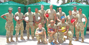 Pacific Partnership’s US Army team at Long Island Elementary School where they installed water catchments for students and teachers. At right, standing, is Marshallese Sgt. Joseia Lemari. Photo: Hilary Hosia.