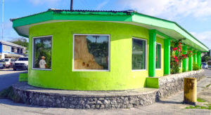 Majuro Computer Services in Majuro showing the main road-facing window, partially covered with plywood, that was broken into in the early morning hours Sunday. Photo: Hilary Hosia.