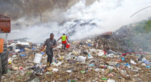 Majuro Atoll Waste Company workers used a bucket brigade to try to contain the fire at the dump March 8. Photo: Hilary Hosia.