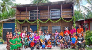 Members of the Laura community join with Growmate Education representatives at the blessing of the new library. Photo: Junko Shindo.