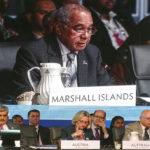 RMI Finance Minister Brenson Wase appeared on a big screen while speaking on behalf of Pacific finance ministers at the ADB annual meeting in Fiji last week. Photo: Kelly Lorennij.