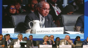 RMI Finance Minister Brenson Wase appeared on a big screen while speaking on behalf of Pacific finance ministers at the ADB annual meeting in Fiji last week. Photo: Kelly Lorennij.