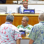 Marshall Islands Speaker Kenneth Kedi, left, talks with legislators from various islands in the Association of Pacific Island Legislatures region. Photo: Kelly Lorennij.