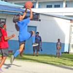 Assumption middle school’s leading scorer Kaniya Jack drives past Majuro Cooperative School defender Jennifer Wase in a recent game during the ongoing Public School System’s Sports and Extracurricular Program school basketball league in Majuro. Photo: Hilary Hosia.