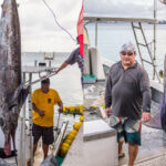 Captain Randy Jack won top honors in the May 9 MBC fishing tourney, while Captain Ronnie Reimers, here with James Myazoe, caught three marlin and padded his President’s Cup lead. Photos: Phil Welch.
