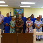 Chief Justice Carl Ingram, third from left, District Presiding Judge Tarry Paul, fourth from right, Namu Nitijela Member Tony Aisaia, second from left, Namu Mayor Junior M. Kabua, second from right, KBE Council members, court staff and family members at the swearing in ceremony for (left to right in blue robes) Namu Judge Liston Albios, Utrok Judge Kobobo Kios and Kili Bikini Ejit Judge Swinton Jakeo. Photo: Hilary Hosia.