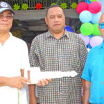 Freddy Digno of J&H Construction presents the key to the new Enwetak warehouse to Mayor Jackson Ading (right) and Interior Grants Manager Fred Nysta. Photo: Wilmer Joel.