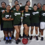 The Rairok women’s team took top honors in the Majuro Day basketball finals competition this past weekend in Laura. With the players is Rairok Councilwoman Margaret Alee, left, and Coach Iso Lat. Photo: Eve Burns.