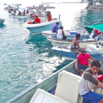 With 50 fishing boats competing in the 10th annual Urok Club July two-day tournament, there was a traffic jam at RRE Shoreline at weigh in time each afternoon — and also plenty of excitement for the hundreds of people watching the action from the shore. Photo: Eve Burns.