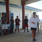 In the early stages of the two-week Jo Jikum Youth Seminar, Tristan Horuichi, right, led an ice breaker game for participants. Photo: Wilmer Joel.