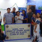 Upward Bound seniors joined with UB staff and tutors to celebrate a great four years with the program and to present this framed mat. Photo: Wilmer Joel .