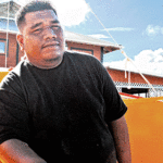 Waan Aelon in Majel instructor and BA-track CMI student John Aine with a WAM-built outrigger canoe. Photo: Wilmer Joel.