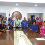 President David Kabua, center, and members of his Cabinet joined with representatives of 19 businesses operating in the Marshall Islands who received Covid-19 relief checks for financial impact of the border closure and other Covid-related problems. The check handover ceremony took place August 7 at the President’s Office. Photo: Eve Burns.