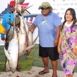 Miss All Micronesia Oronia Kinono joins with KBE Mayor Anderson Jibas, second right, and the KBE team, which caught the winning marlin and came in third overall in points. Photo: Eve Burns.