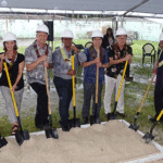 A big turnout of VIPs, including landowners, Cabinet members, ambassadors, pastor, and Ministry of Health and Human Services officials joined in the groundbreaking for renovation of a warehouse. Photo: Eve Burns.