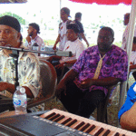 Mon La Mike Band in action with Eddie Enos (left) and Bed Shamory performing at the Kwajalein Annual Cultural Day festivity recently.