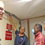 USAG-KA Commander Jeremy Bartel (left) and Kwajalein Hospital Administrator Steve Kass gave a tour of isolation and quarantine facilities to a Nitijela delegation this past summer. Photo: Hilary Hosia.