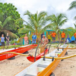 Members and friends of Majuro Ocean Sports Club stand by as Waan Aelon in Majel (Canoes of the Marshall Islands) Director Alson Kelen blesses the new paddling canoes on the beach in front of the University of the South Pacific campus in Majuro November 7. Photo: Anastasia Dujmovic.