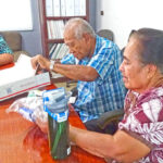 RMI EPA Deputy General Manager Kimber Rilometo, left, assisted with delivery of gifts from Texas-based soldiers for the parents of the late SSG Solomon Sam, Rev. Harry and Teaoi Sam. Photo: Eve Burns.