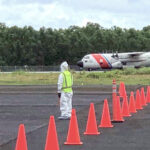 An Air Station Barbers Point HC-130 Hercules airplane lands at Pohnpei International Airport, FSM, carrying passengers from Guam during a repatriation fight May 13. The humanitarian flights were the first to allow passengers to deplane in the FSM since the country closed its borders in March 2020 due to the Covid-19 pandemic.