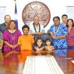 Joining President David Kabua and Health Minister Bruce Bilimon at the signing ceremony June 3 were, from left: Apo Myazoe (NRC), Luren Ading (WUTMI), Tanner Smith (Wellness Center), Abacca Anjain-Maddison (Deputy Chief Secretary), Jack Ading Jr., Lula Ading-Yamane, Fenice Riklon, Sage deBrum (CIA), Molly Helkena (National Advisor for ECD), Kate McDermott (PSS), Theresa Kijiner (PSS), and Rachel Bigler (MOHHS). Photo: Wilmer Joel.